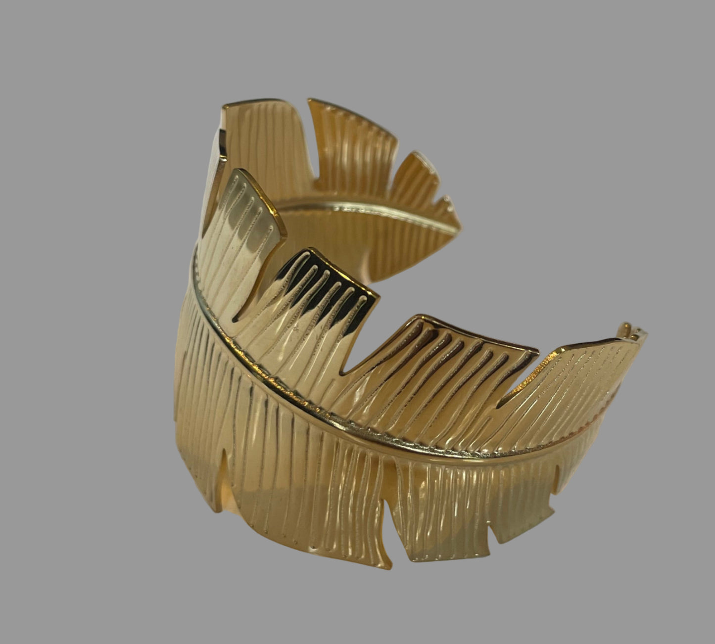 Manchette plume doré