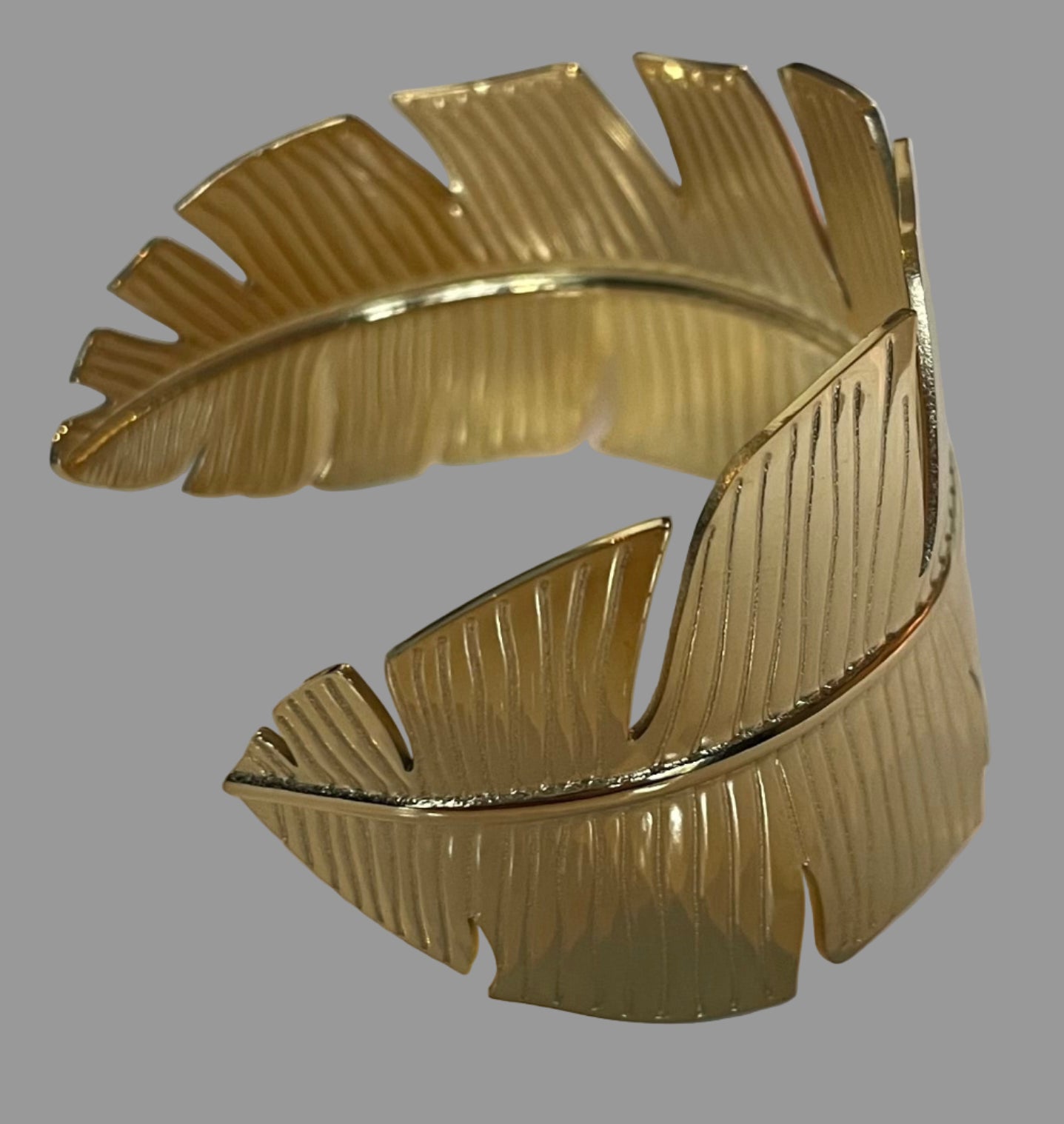 Manchette plume doré